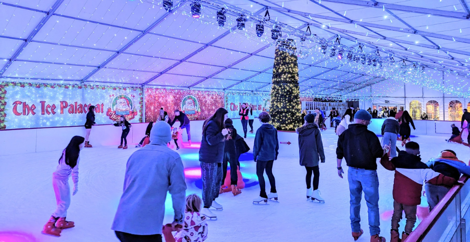 People on an ice skating rink at Plymouth's Winter City